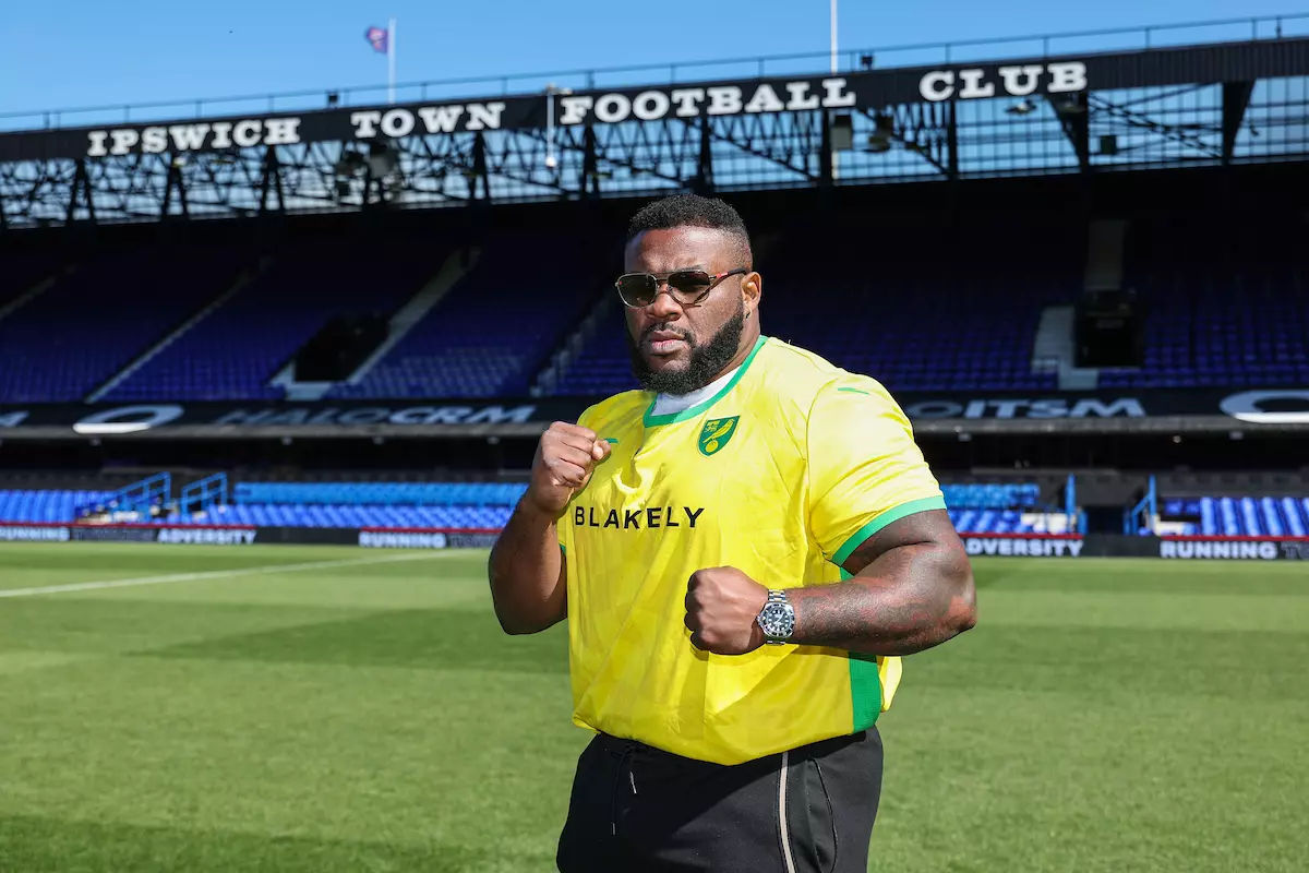 Jarrell Miller in a Norwich City football shirt in a promo photo before his fight with Fabio Wardley was cancelled