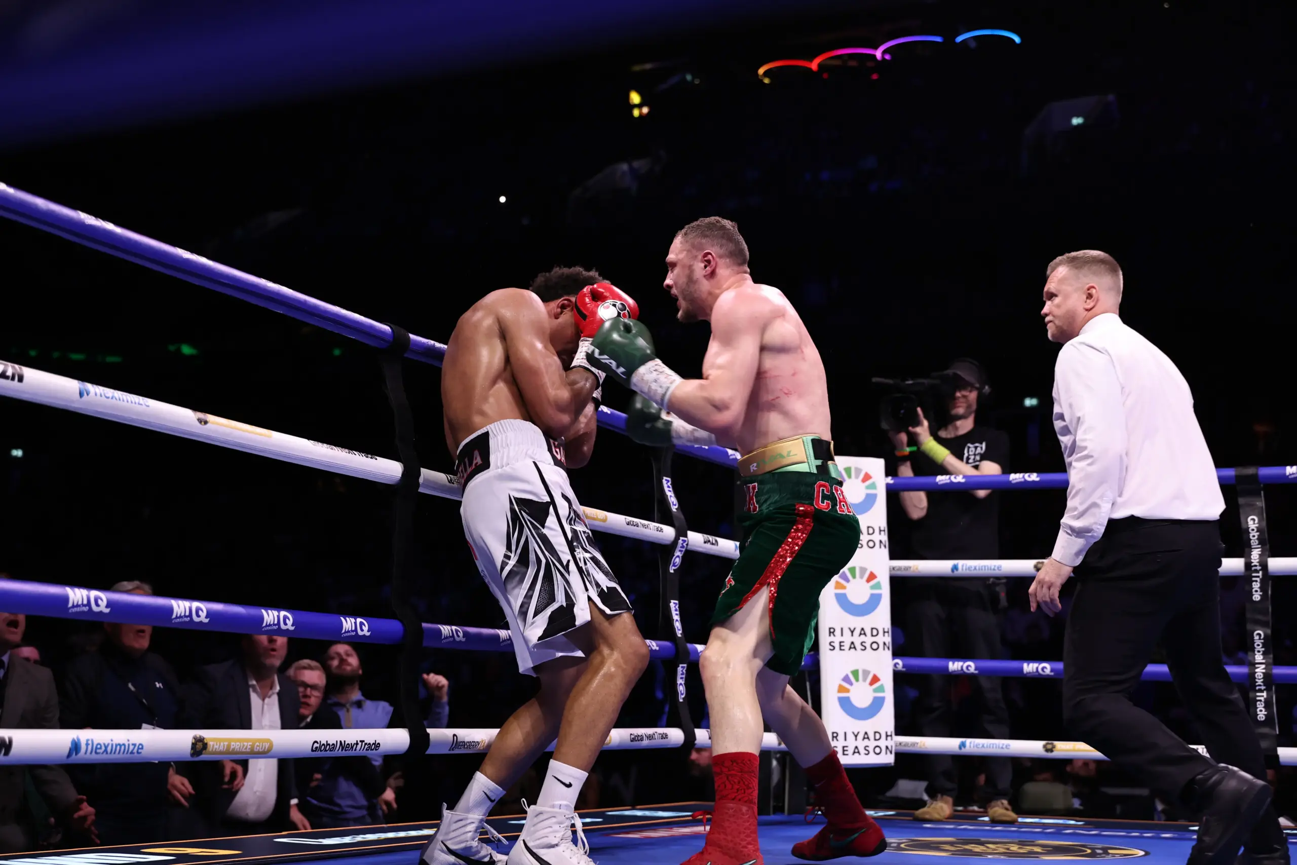 Zak Chelli backing David Morrell up against the ropes on May 9