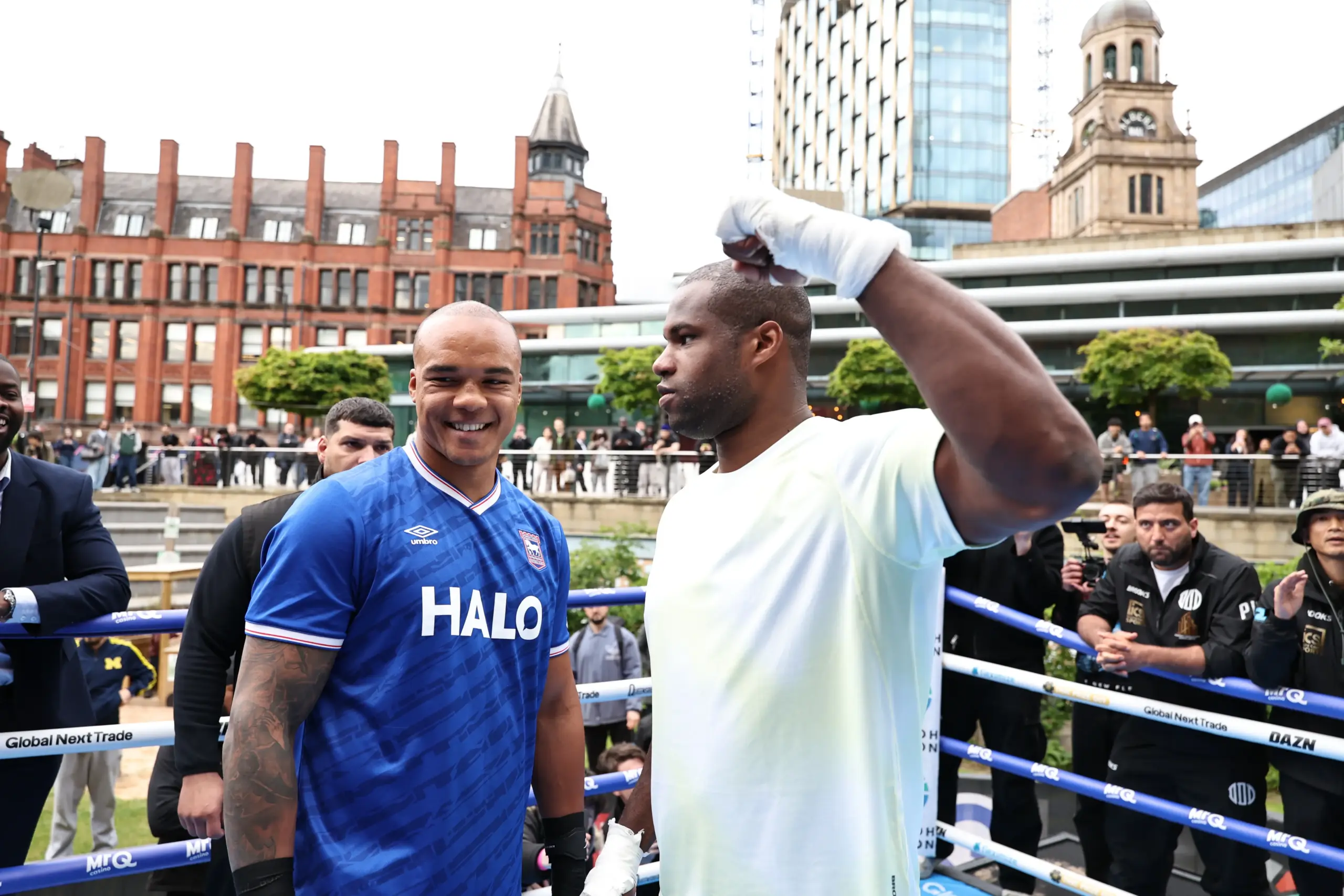 Fabio Wardley looks at the camera as Daniel Dubois stares him down at media day/public workout